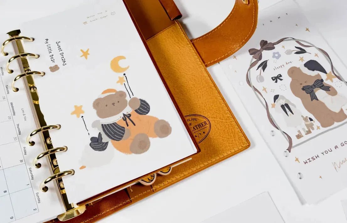 Agenda à anneaux avec pages de recharges illustrées