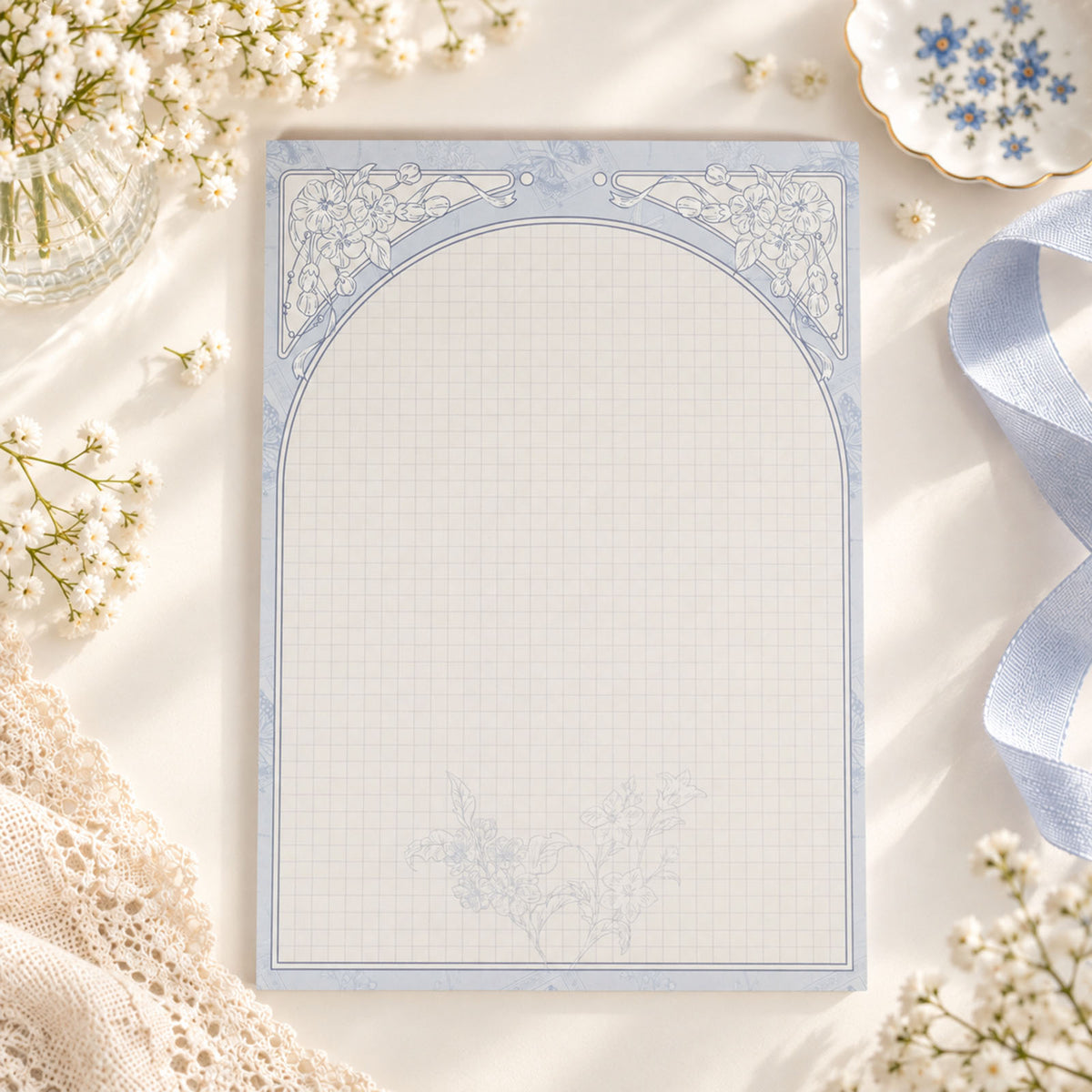 Bellflower B5 vertical grid notepad with delicate blue botanical frame