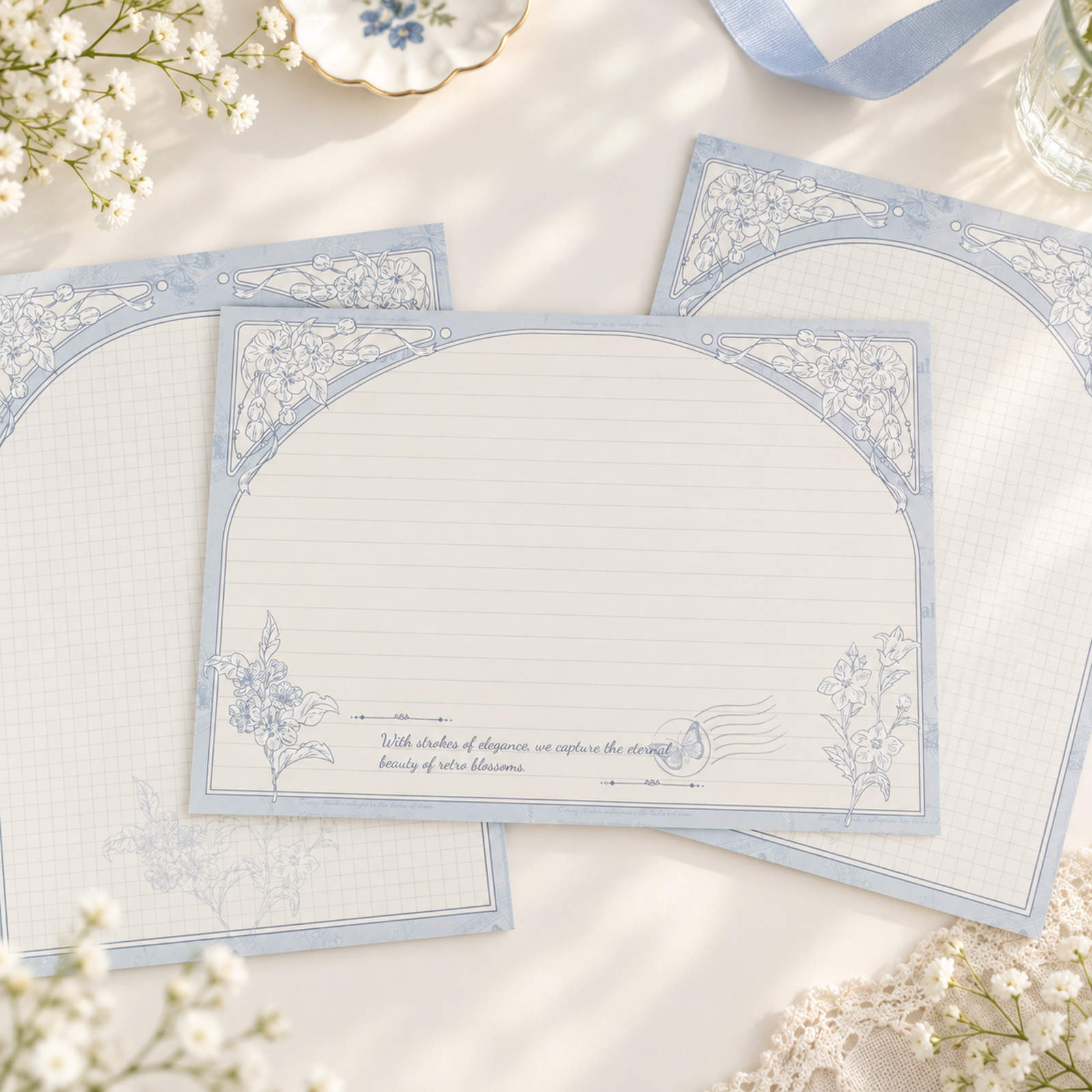Bellflower B5 notepads with blue hand-drawn floral borders and lined layouts