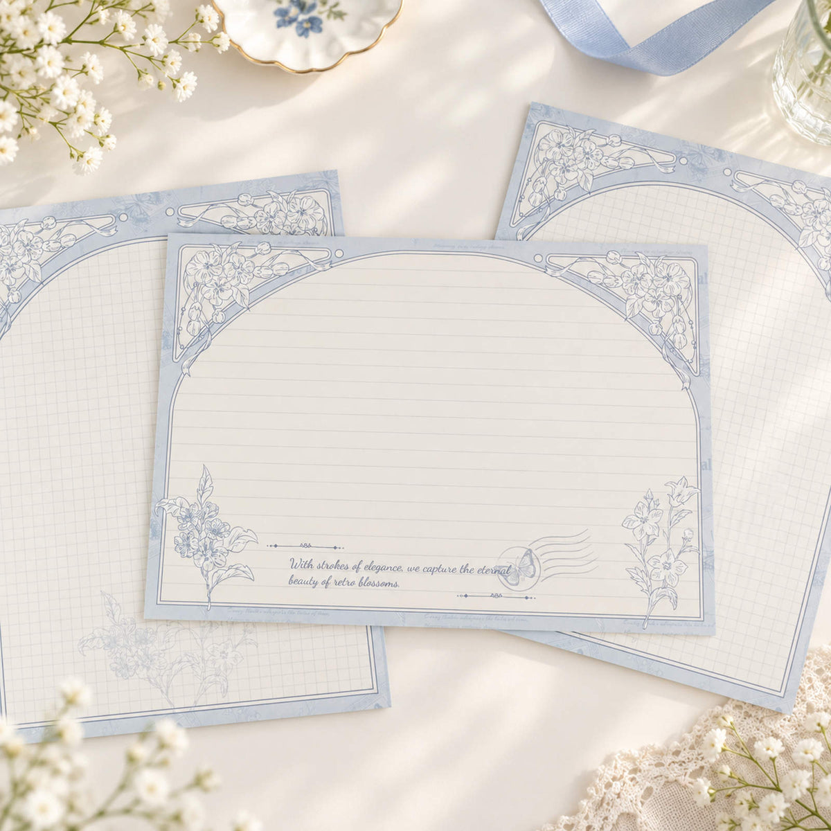 Bellflower B5 notepads with blue hand-drawn floral borders and lined layouts