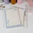 Butterfly and Flower A6 notepad placed on desk with pen and soft lighting - Miouva