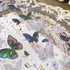 Close-up of iridescent butterfly designs with soft pink and blue reflections on transparent PET tape - Miouva