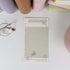 Close-up of punched planner refill with butterfly stamp artwork - Miouva