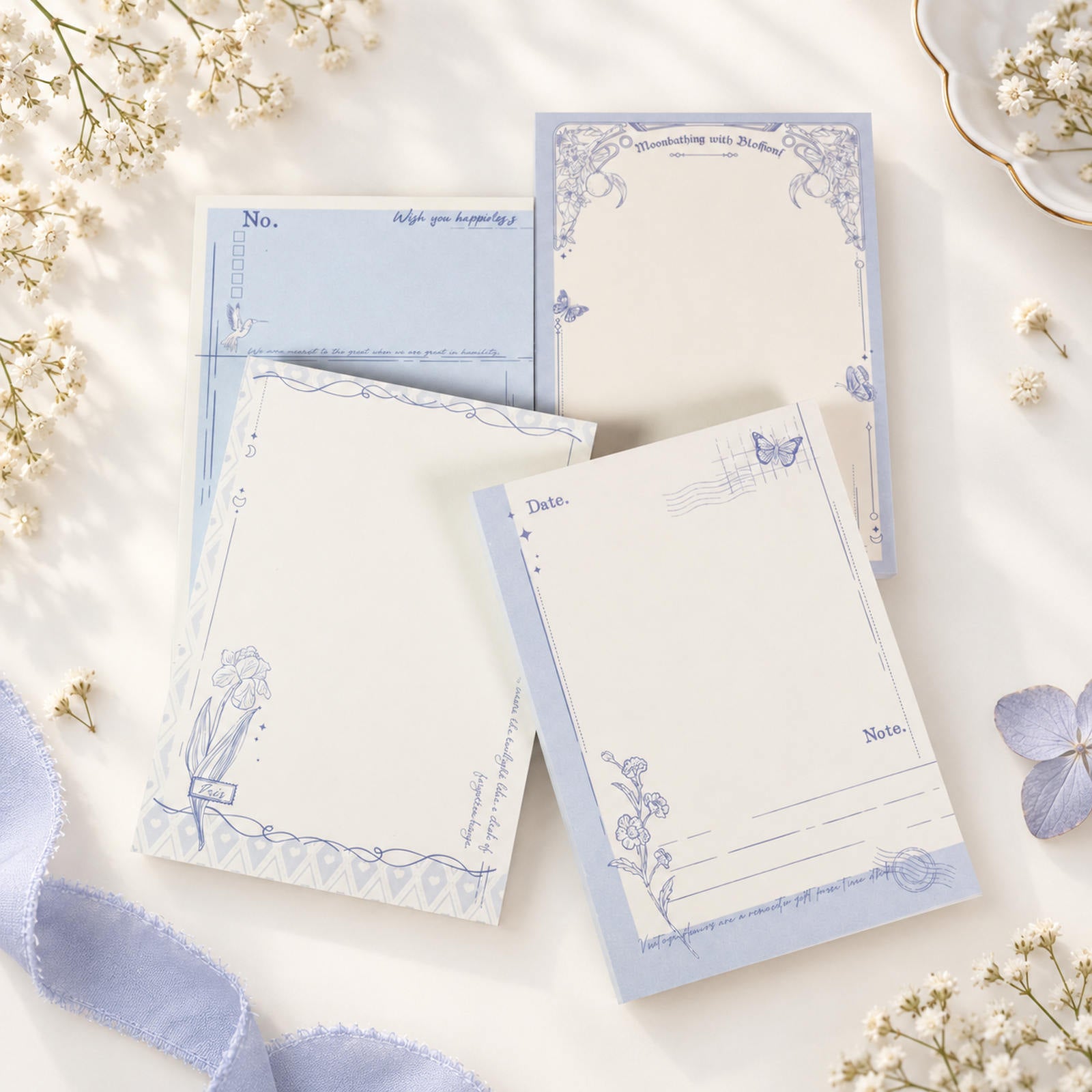 Butterfly & Flower A6 notepads with soft blue floral and butterfly designs