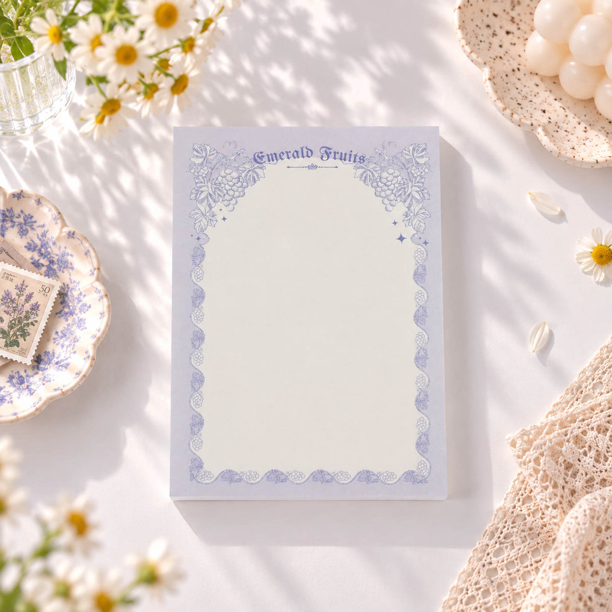 Emerald Fruits A6 notepad with lavender botanical frame and writing space
