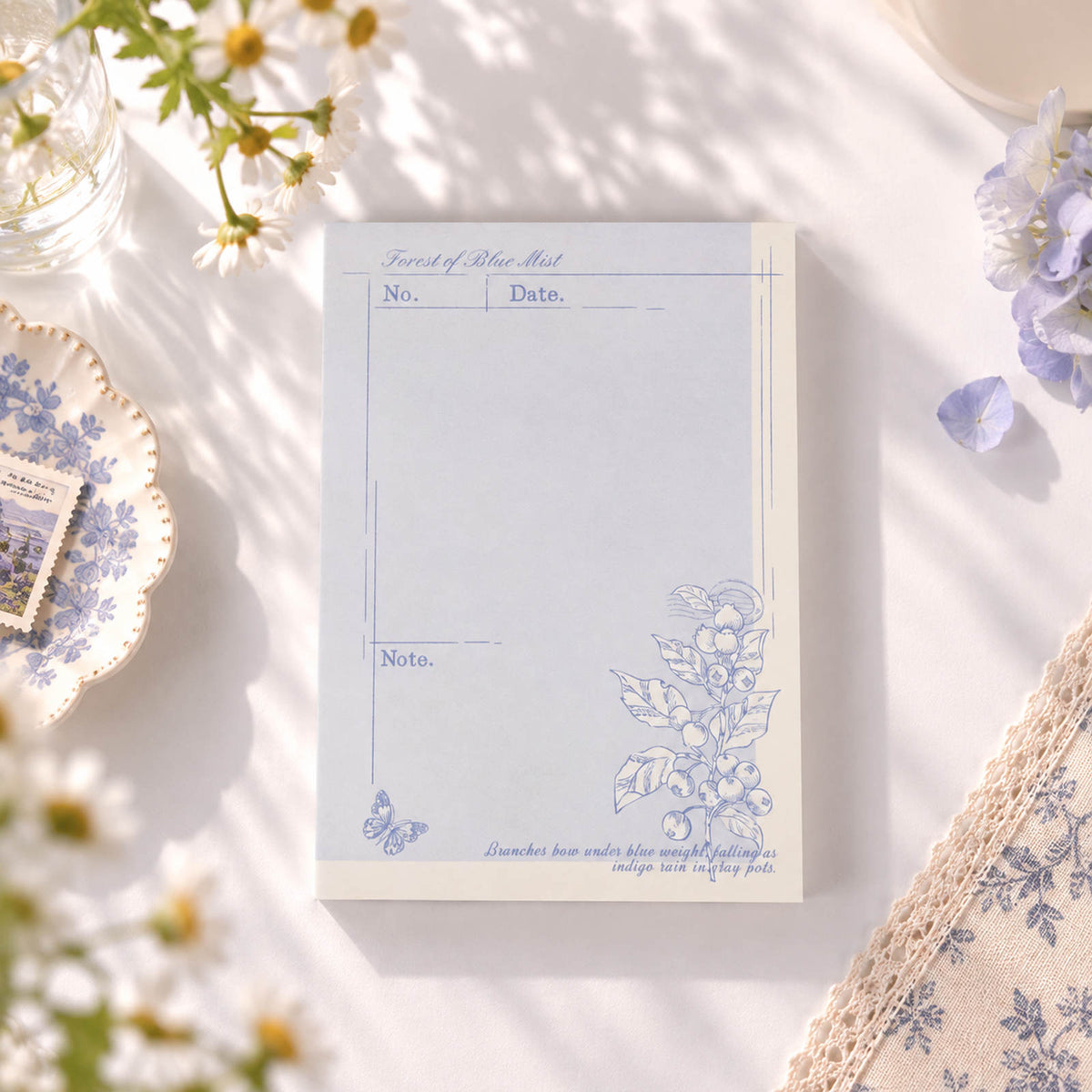 Forest of Blue Mist A6 notepad with purple botanical border and lined layout