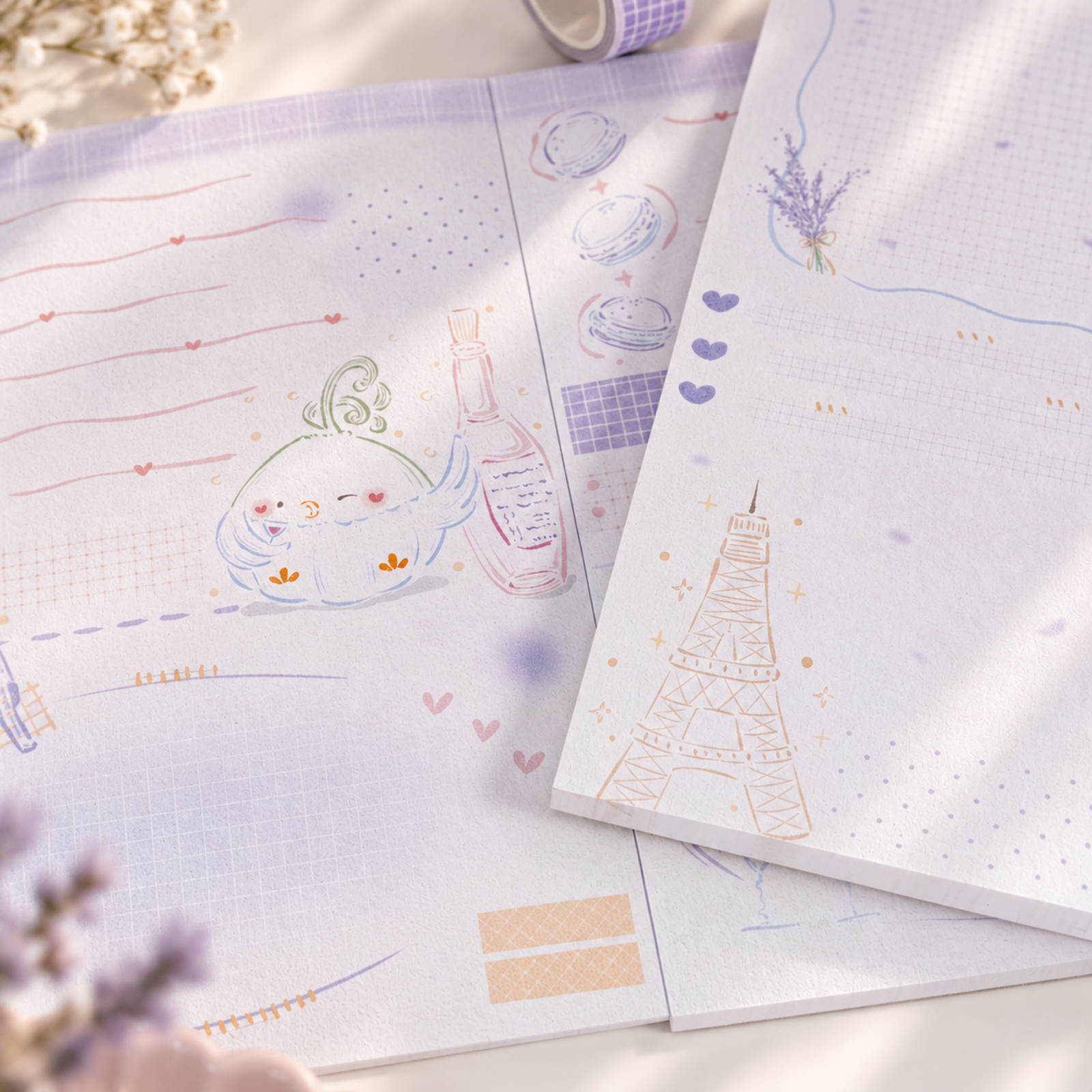 Little Chirp A6 notepad detail with illustrated Eiffel Tower design
