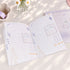 Little Chirp A6 notepad open pages with soft purple stationery illustrations