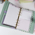 Pink & Ink Planner Refills displayed inside a personal planner binder showing black and pink contrast design - Miouva
