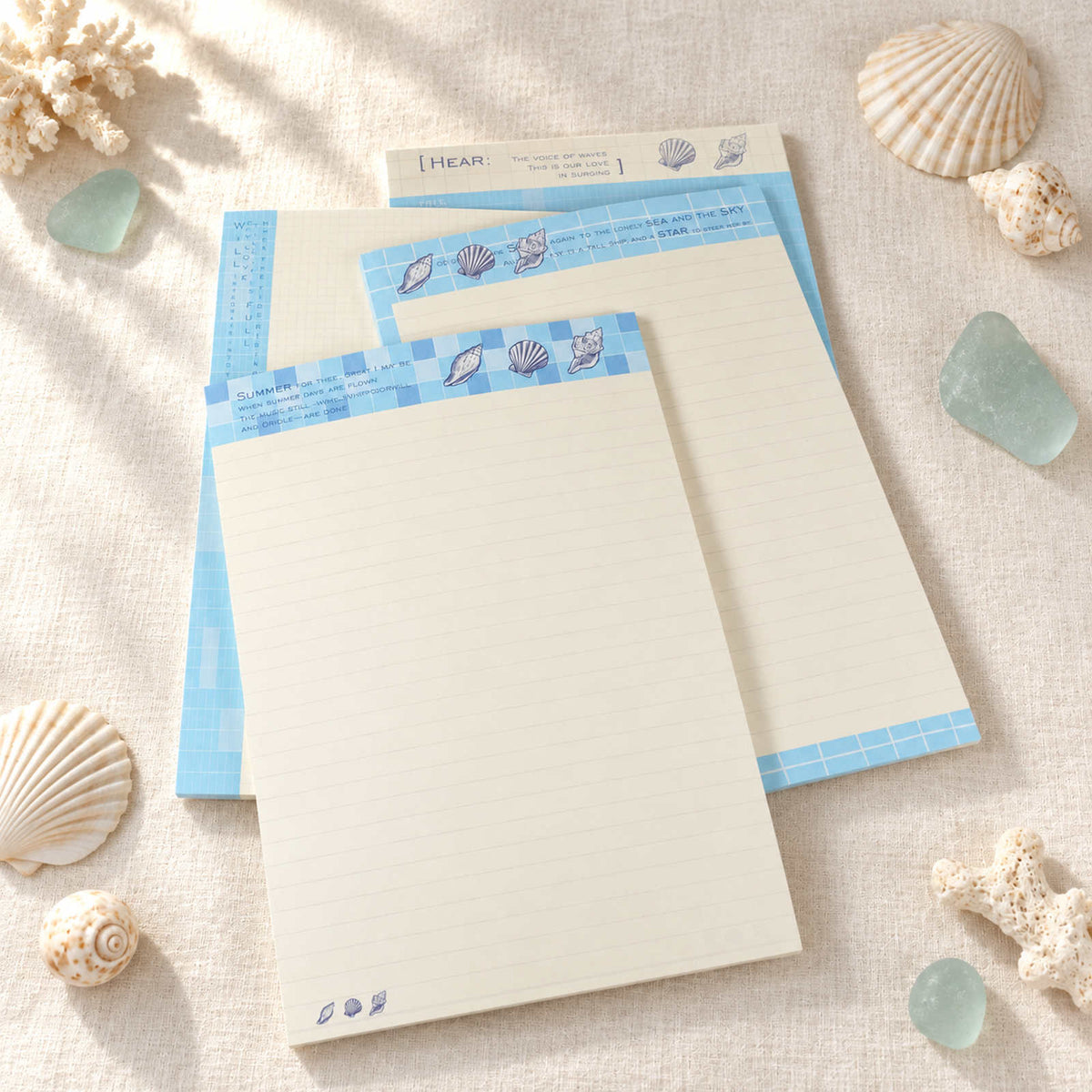 Blocs-notes B5 Summer Beach dans quatre motifs de coquillages bleus et crème