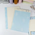 Flat lay of grid and lined notepad pages from Summer Beach B5 writing pad - Miouva