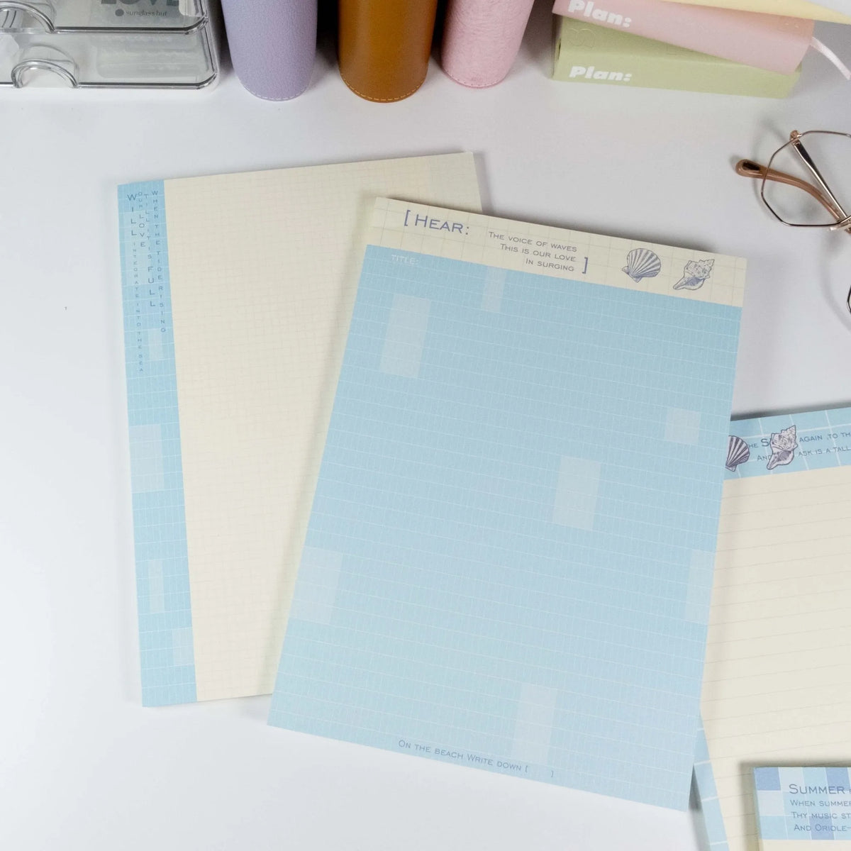 Flat lay of grid and lined notepad pages from Summer Beach B5 writing pad - Miouva