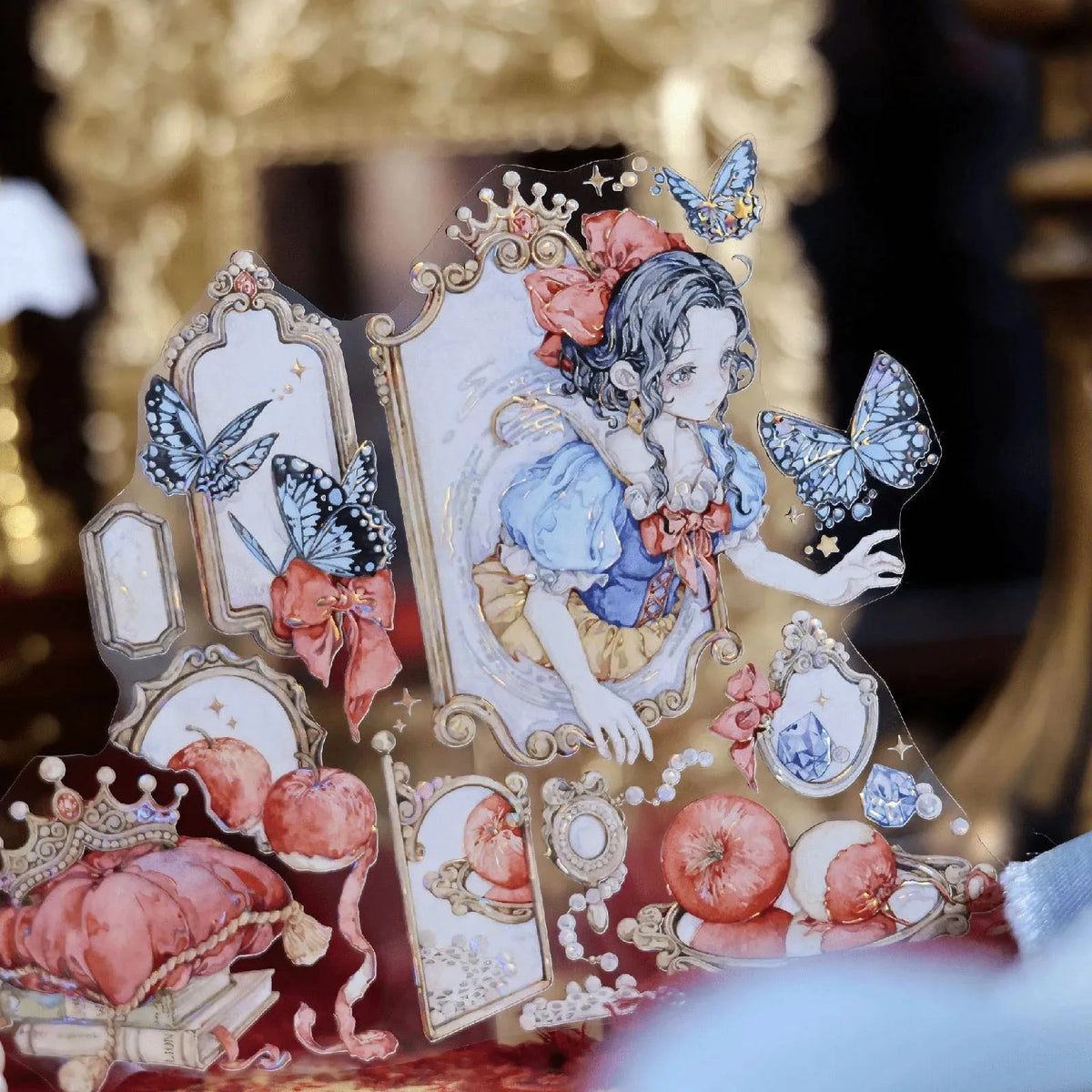 Snow White PET tape detail with ornate mirrors, blue butterflies, apples and a character portrait