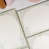 Flat-lay of Thorn Rose B5 notepad showing elegant lined pages - Miouva